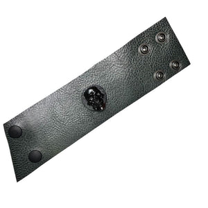 • Wornstar Custom Stage Wear Collection• Custom leather wrist band• Ready to Ship. • Designed, made, and sold exclusively by Wornstar Clothing• Individually made; each one will vary slightly• Made with soft, thick, leather• Drab, dark, olive green color• Hand-set black, distressed, metal skull• Hand-distressed•