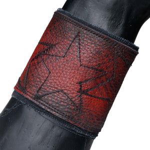 • Wornstar Custom Stage Wear Collection• Custom leather wrist band• Completely hand-made at the time of order• Designed, made, and sold exclusively by Wornstar Clothing• Individually made; each one will vary slightly• Made with soft upcycled leather• Lined with fabric for comfort• Hand-studded detail• Hand-painted•