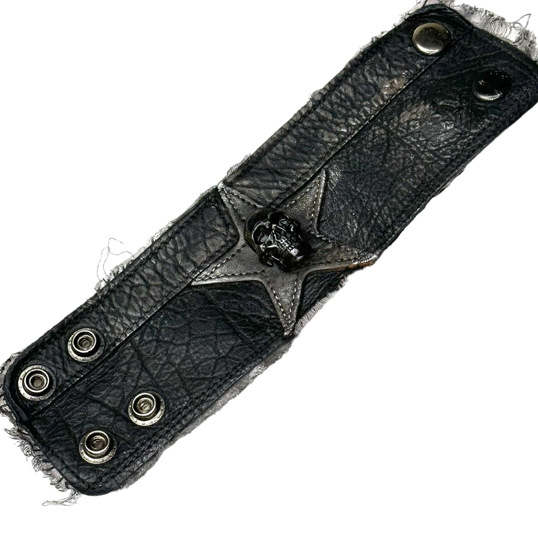 • Wornstar Custom Stage Wear Collection• Made at time of order. Custom leather wrist band• Designed, made, and sold exclusively by Wornstar Clothing• Completely hand-made• Individually made; each one will vary slightly• Made with soft leather• Metal skull accent• Lined for comfort• Hand-distressed• Hand-painted•