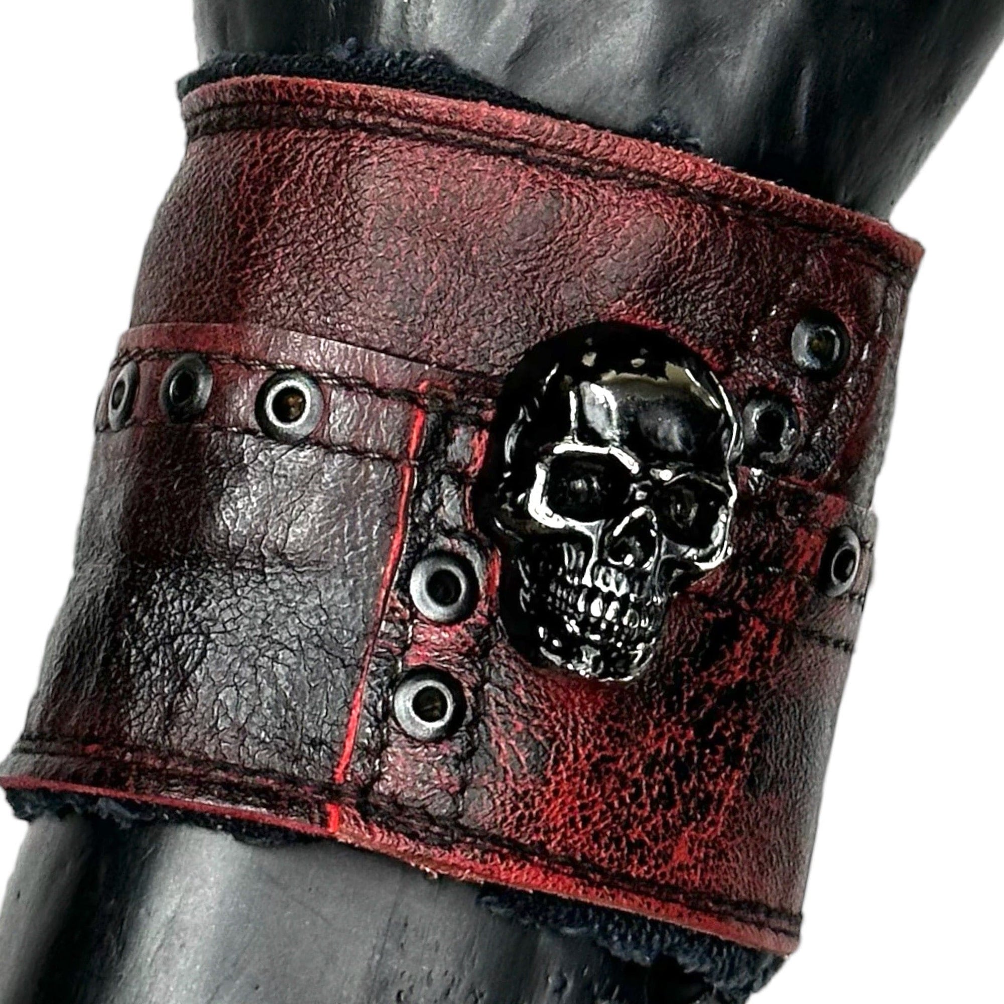 • Wornstar Custom Salvaged Collection• Ready to ship - Custom leather wrist band• One of a kind• Designed, made, and sold exclusively by Wornstar Clothing• Completely hand-made• Individually made; each one will vary slightly• Made with soft leather• Lined for comfort• Hand-made detail with metal, skull accent•