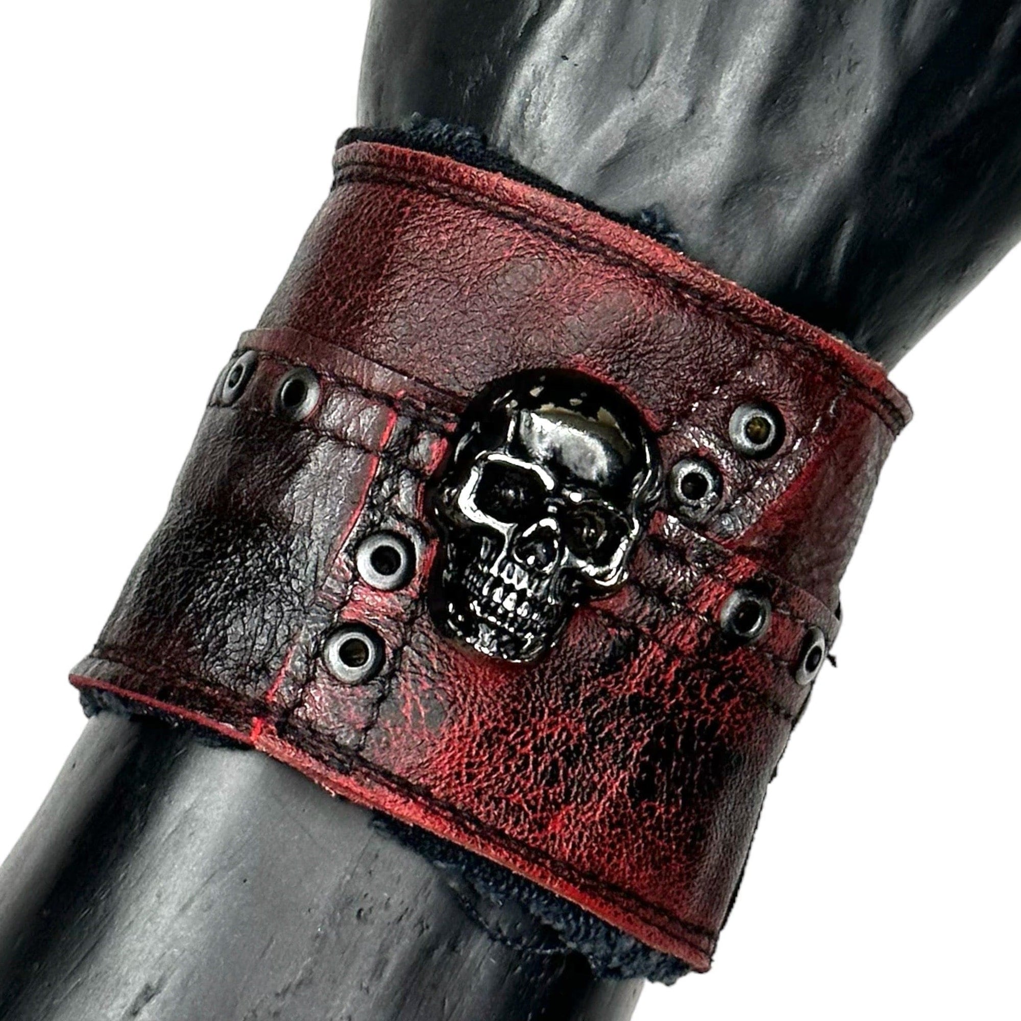 • Wornstar Custom Salvaged Collection• Ready to ship - Custom leather wrist band• One of a kind• Designed, made, and sold exclusively by Wornstar Clothing• Completely hand-made• Individually made; each one will vary slightly• Made with soft leather• Lined for comfort• Hand-made detail with metal, skull accent• 