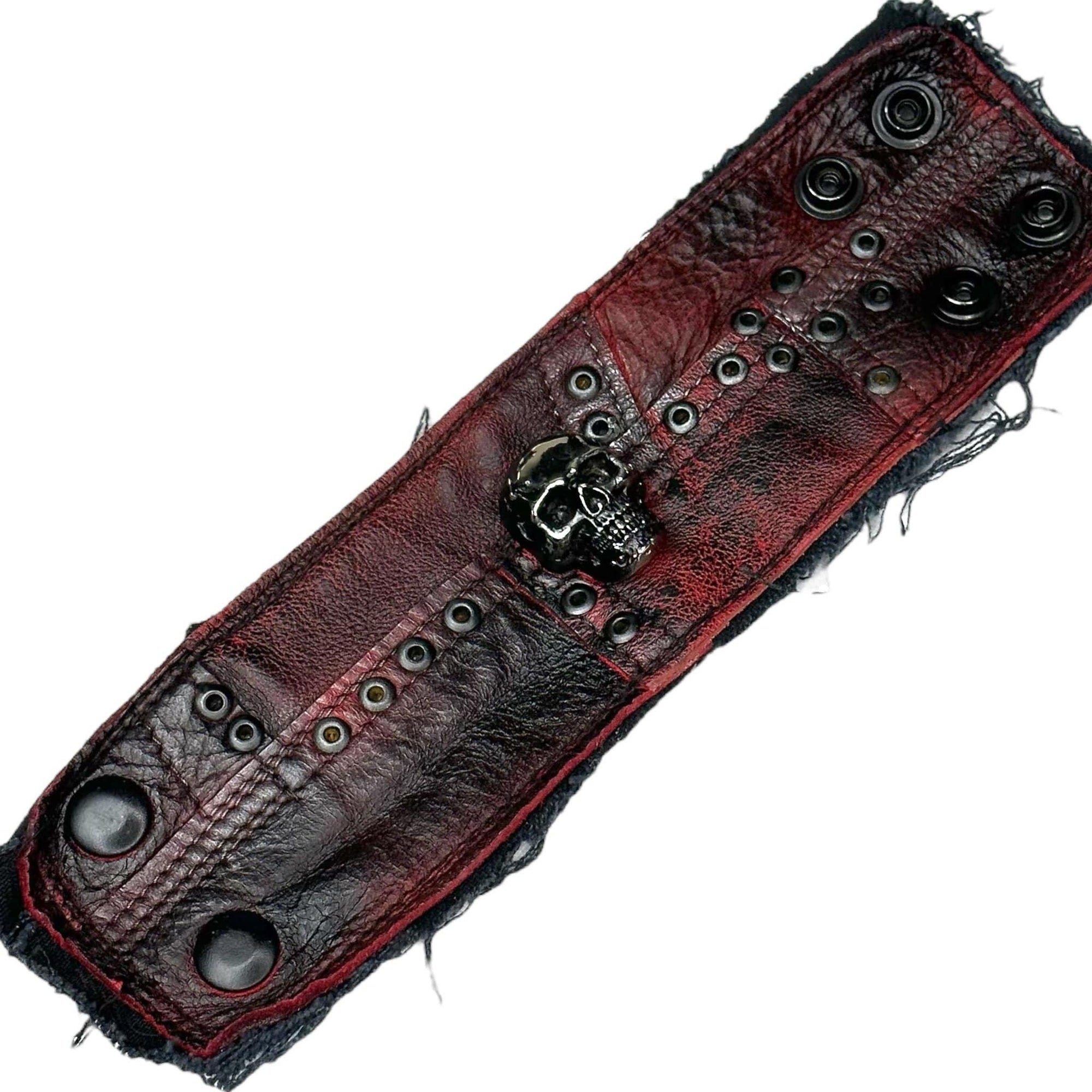 • Wornstar Custom Salvaged Collection• Ready to ship - Custom leather wrist band• One of a kind• Designed, made, and sold exclusively by Wornstar Clothing• Completely hand-made• Individually made; each one will vary slightly• Made with soft leather• Lined for comfort• Hand-made detail with metal, skull accent• 
